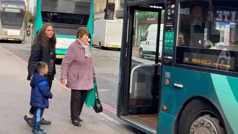 BBC/Patrick O'Hagan Passengers getting on bus in Reading