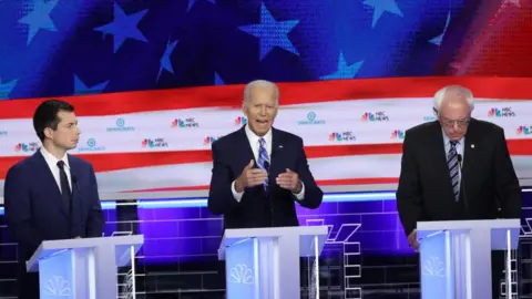 Drew Angerer/Getty Images Pete Buttigieg, Joe Biden and Bernie Sanders at the first Democratic debate