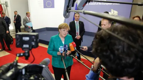 AFP Angela Merkel speaks after talks