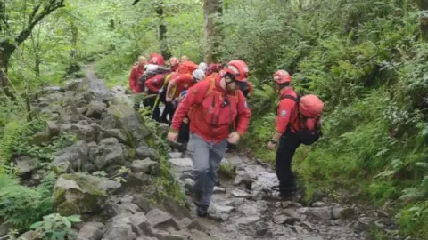 Central Beacons Mountain Rescue people carrying stretcher