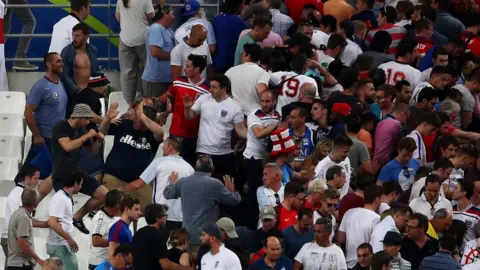 Getty Images Russia fans charge England fans