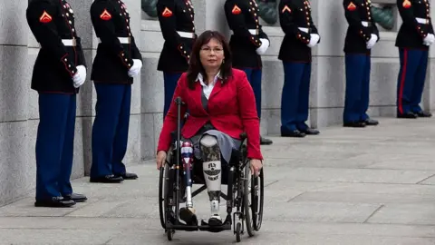 Getty Images Tammy Duckworth arrives at a World War II Memorial ceremony to pay tribute to World War II veterans of the Pacific on March 11, 2010