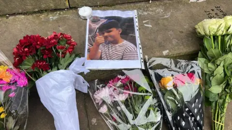 BBC A photo of one of the boys on the steps of Shrewsbury College