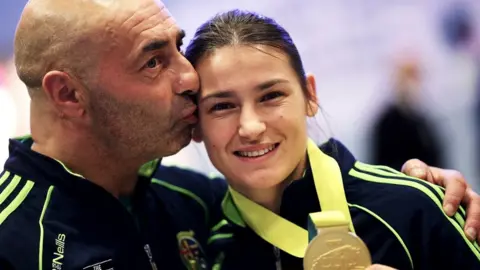 PA Pete Taylor and Katie Taylor
