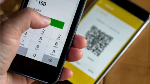 Getty Images Mobile phone payment