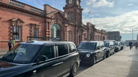 LDRS Black taxis lined up outside Nottingham Railway Station