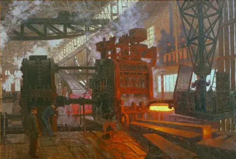Antony Easton
The painting Eisenwalzwerk by the artist Hans Baluschek shows an industrial scene inside a large factory or foundry, with workers operating heavy machinery. A massive press or forging machine glows with intense heat as it processes hot metal. The space is filled with smoke and steam, with natural light streaming through high windows, creating a dramatic atmosphere of intense labor and industrial activity.