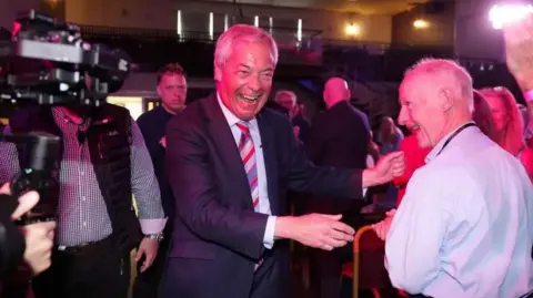 Reform UK leader Nigel Farage meeting supporters 