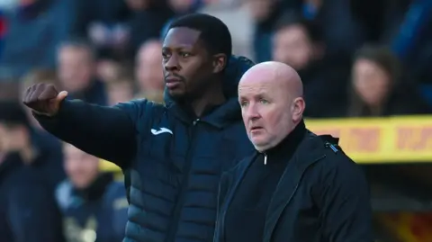 Marvin Bartley and David Martindale in the Livingston dugout