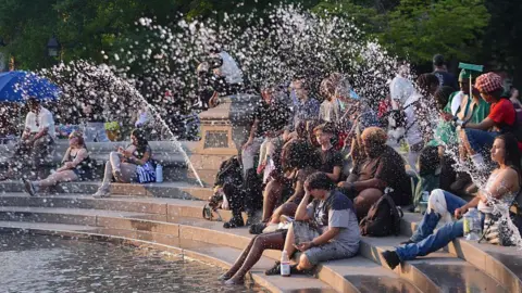 People spend time at Washington Square Park during hot weather in New York City, United States, on June 29, 2026. New York City Mayor Zohran Kwame Mamdani activated the city's Heat Emergency Plan as dangerously high temperatures were forecast to affect the city