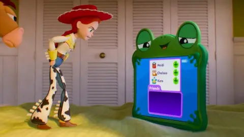 PA An image captured from the Toy Story 5 movie, with Jessie confronting a children's tablet computer