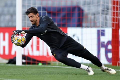 Real Madrid keeper Thibaut Courtois diving in training
