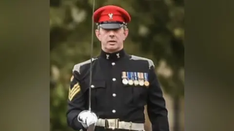 Other Staff Sergeant John McKelvie in uniform on parade