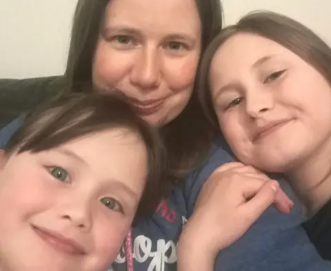 Emma Payne Emma with Charlotte, 10, and Sophie, eight