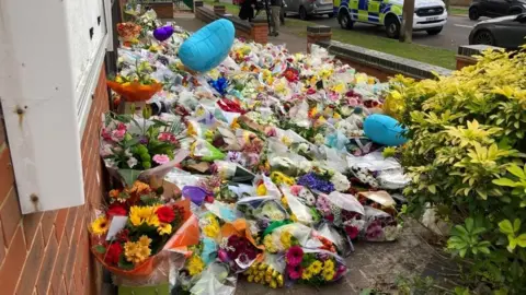 Richard Smith/BBC Floral tributes