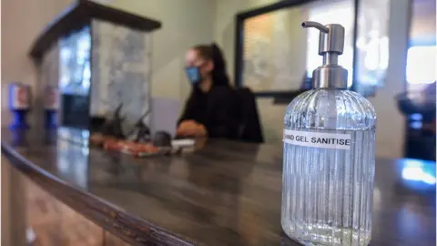 Getty Images Hand sanitiser at a hotel