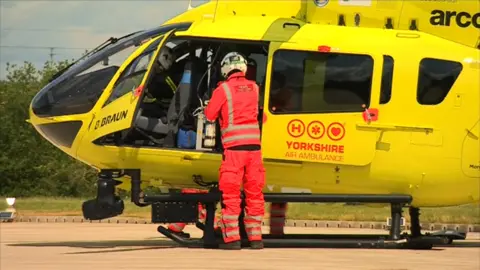 Crew getting into ambulance