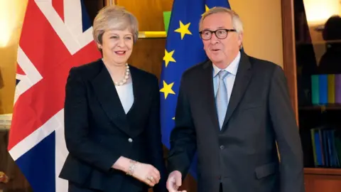 AFP/Getty Images Theresa May and Jean-Claude Juncker are meeting in Strasbourg