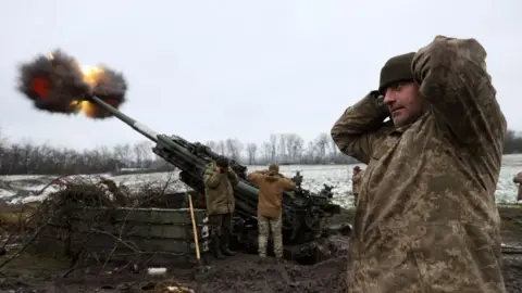 Getty Images Ukrainians fire a British-made artillery piece against the Russian invaders, November 2022