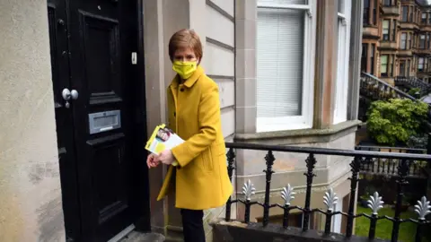 Getty Images Nicola Sturgeon on a doorstep
