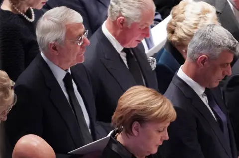 Getty Images John Major, Prince Charles and Angela Merkel