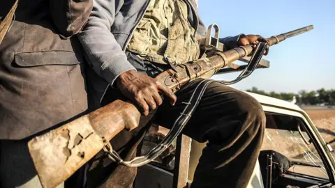 Getty Images A man holding a gun