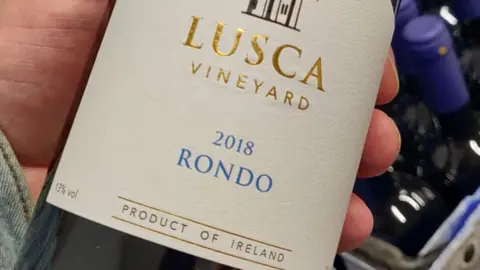 David Llewellyn A bottle of red wine with the label Lusca vineyard 2018 rondo produce of Ireland