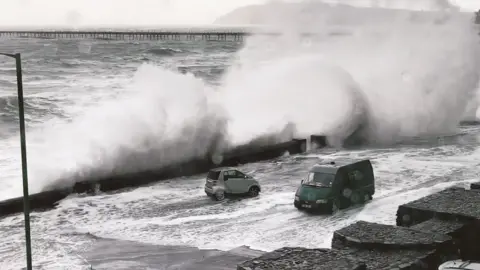 Rebecca Odessa Queen's Promenade in Ramsey flooded by waves