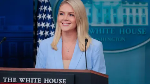 Getty Images White House Press Secretary Karoline Leavitt talks to reporters during a news conference in the Brady Press Briefing Room