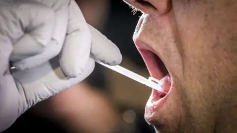 LEX VAN LIESHOUT A DNA sample is taken on August 22, 2018 from Landgraaf mayor Raymond Vlecken during a trial before the launch of a massive DNA search project in the hunt for the killer of 11-year old Nicky Verstappen