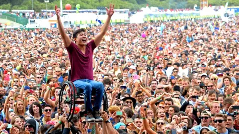 Getty Images A wheelchair users crowd-surfs at California's Outside Lands festival