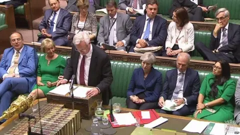 AFP Brexit Secretary David Davis addressing MPs, flanked by Theresa May and Andrea Leadsom