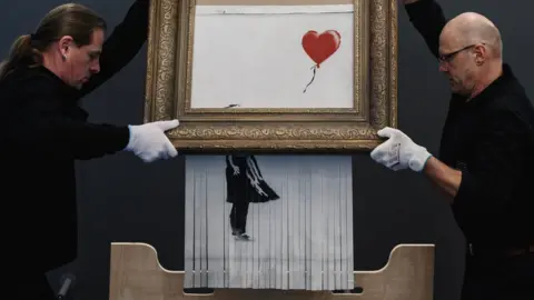 Alexander Scheuber/Stringer Banksy