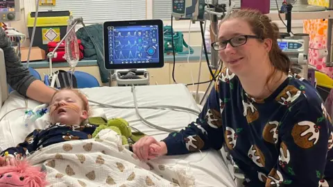 Emily Stringer Emily Stringer with Caitlyn in hospital
