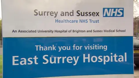 A hospital sign that says thank you for visiting East Surrey Hospital