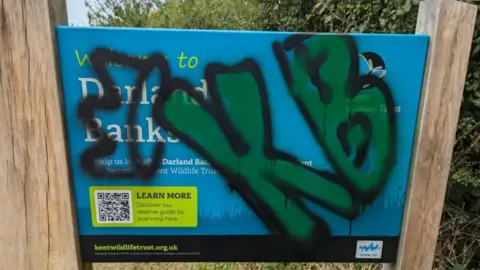 Vandalised sign at Darland Banks in Gillingham 