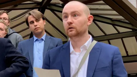 PA Media Michael Callaghan speaking outside Birmingham Crown Court after Mcleod's sentencing.