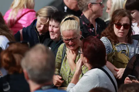 PA Media Mourners pay tribute to Sinéad O'Connor in Bray on 8 August 2023