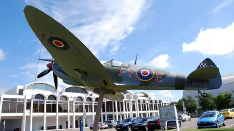 Getty Images A World War Two aircraft mounted outside a museum building