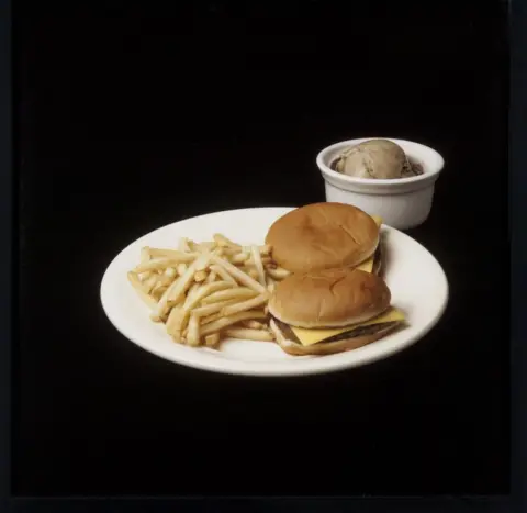 Jackie Black A meal featuring two burgers, french fries and ice cream