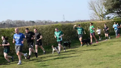 Kevin Ward Kevin Ward running with his dog Wilson at the Kesgrave Parkrun