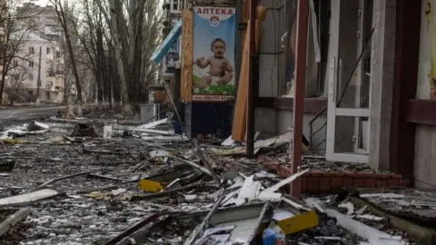 EPA A photo of a child at destroyed pharmacy in the city of Bakhmut, eastern Ukraine. Photo: January 2023