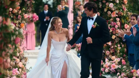 Patrick Wymore/HBO Cassie and Nate walking down the aisle 