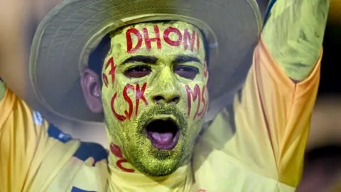 AFP A fan of Chennai Super Kings' MS Dhoni cheers before the start of the Indian Premier League (IPL) Twenty20 cricket match between Chennai Super Kings and Gujarat Titans at the MA Chidambaram Stadium in Chennai on March 26, 2024