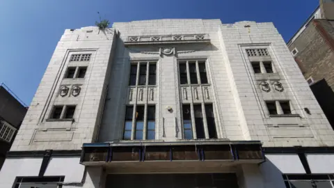 Museum of Cambridge Front of the building at 21 Hobson Street, white facade is slightly discoloured and the old cinema sign is removed