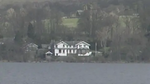 A screenshot taken from a archive footage. A general view of Sharrow Bay pictured from Ullswater.