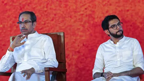 Getty Images Uddhav Thackeray with his son Aditya