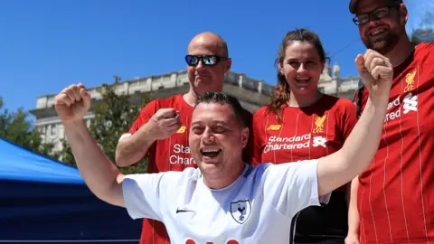 PA Tottenham fan and Liverpool fans
