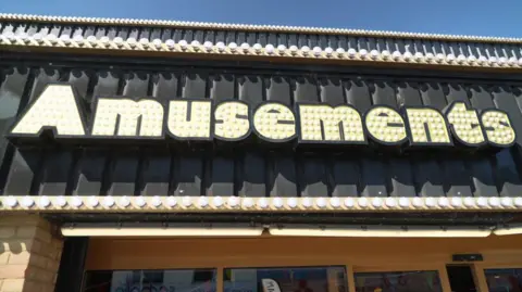 A sign that says amusements. 