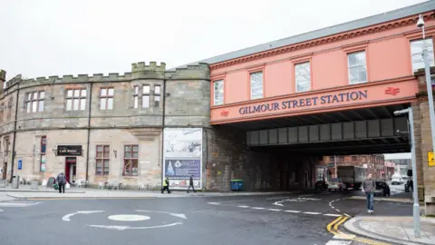 Getty Images Pedestrians and traffic on the streets around Gilmour Street railway station in the centre of Paisley, Scotland.